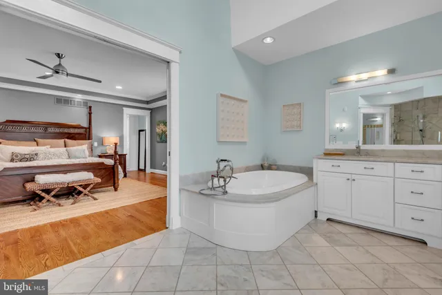 a bedroom with a bed a desk and chair