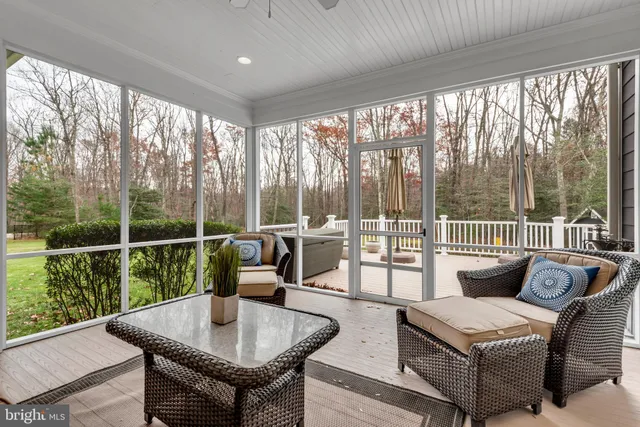 a spacious bedroom with a bed and dresser