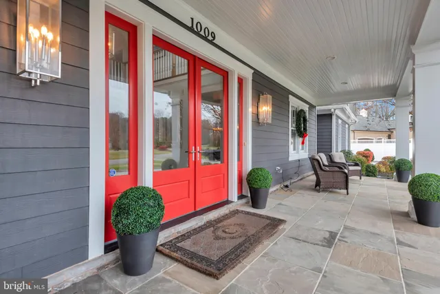 a lobby with furniture and potted plant