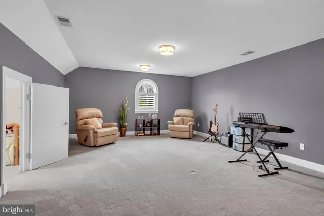 a view of a patio with table and chairs
