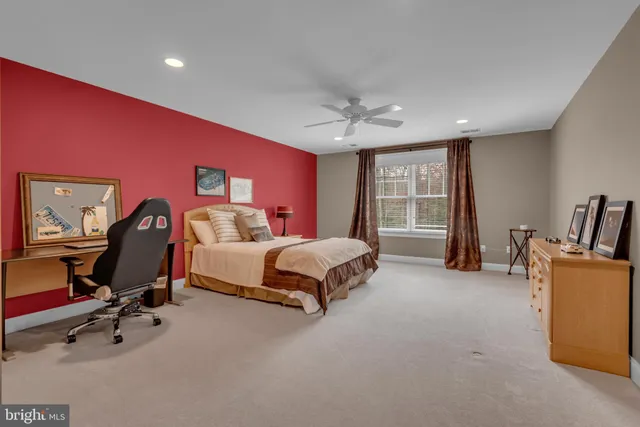 a view of a house with a barbeque and wooden deck