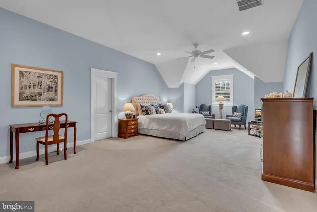 a backyard of a house with table and chairs in it