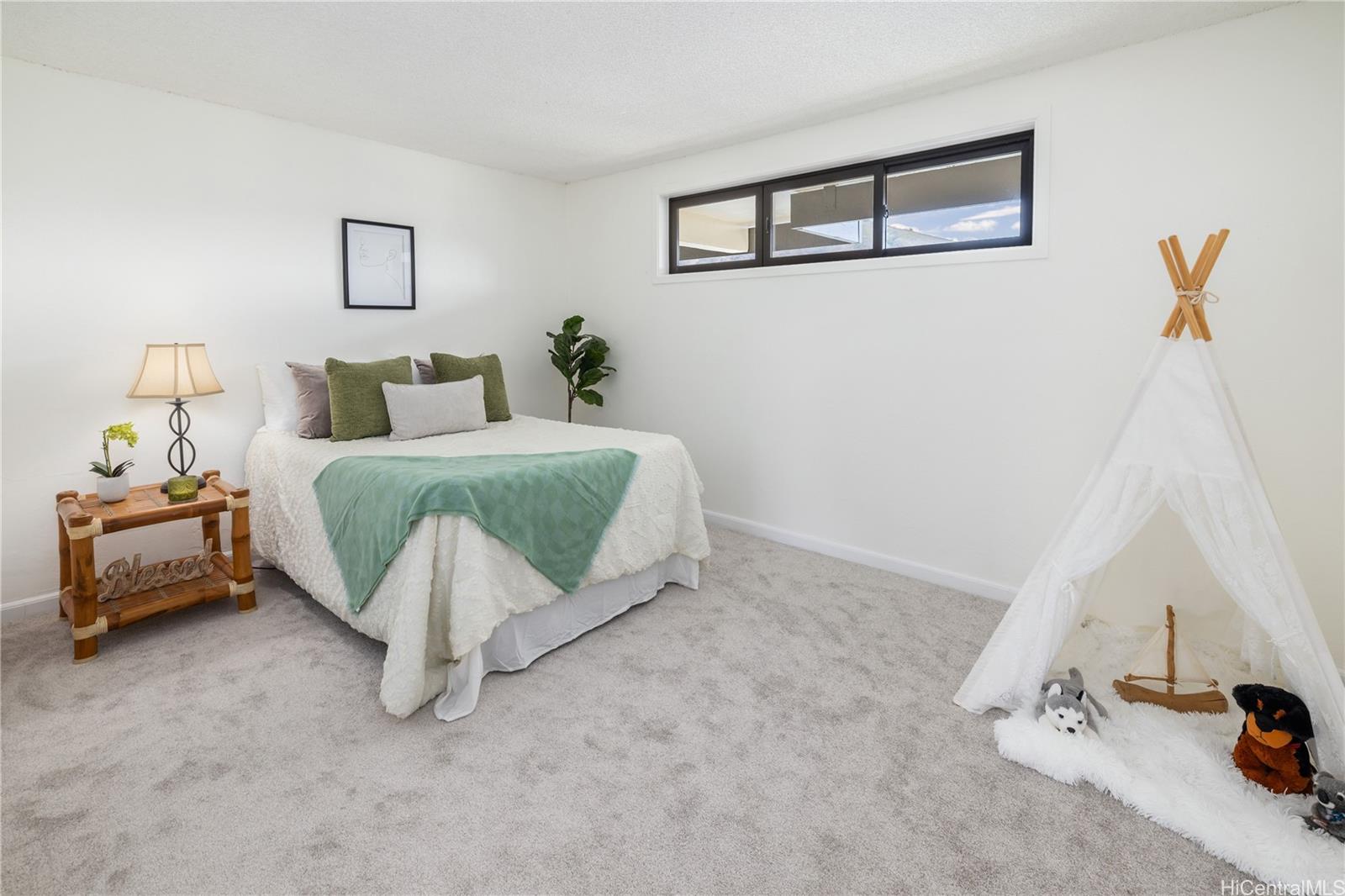 500 Lunalilo Home Road, Unit 16G Honolulu, HI 96825 - Photo 12 of 25 a bedroom with a bed and a window