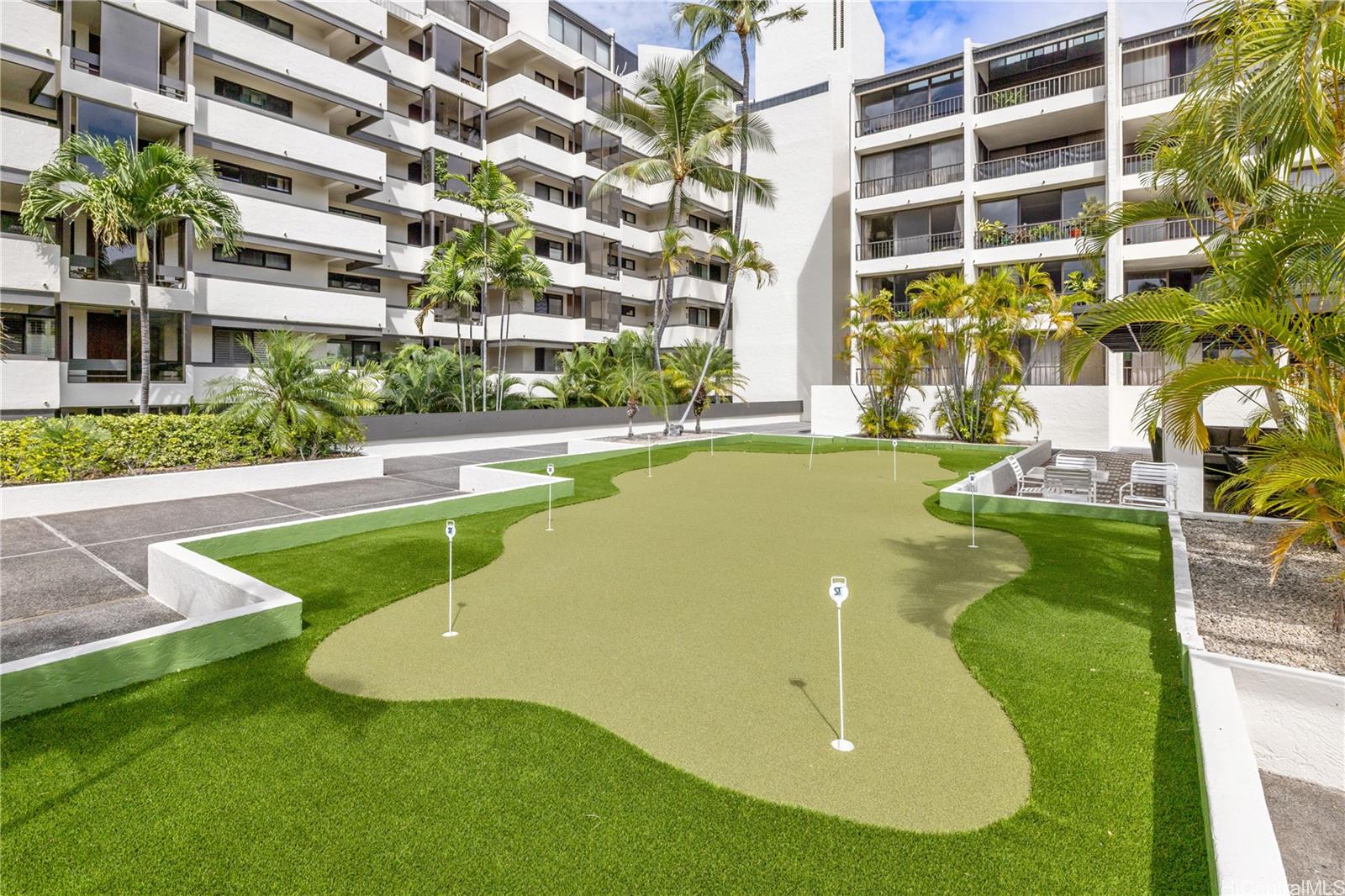 500 Lunalilo Home Road, Unit 16G Honolulu, HI 96825 - Photo 17 of 25 a view of a swimming pool with a yard