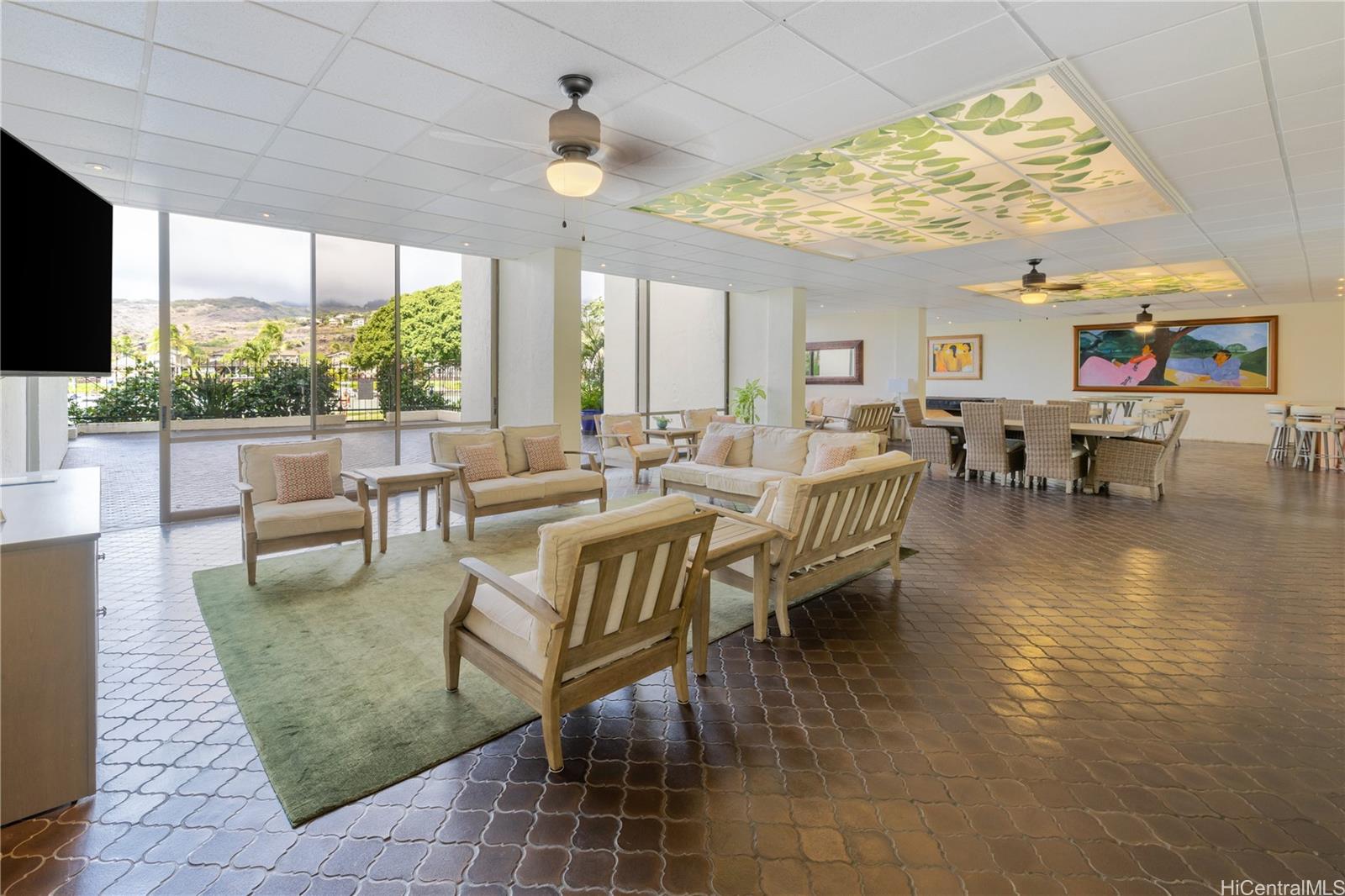 500 Lunalilo Home Road, Unit 16G Honolulu, HI 96825 - Photo 23 of 25 a living room with fireplace furniture and a flat screen tv