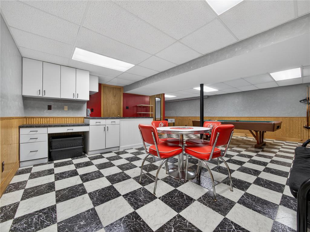 853 Lahr Road Nazareth, PA 18064 - Photo 20 of 29 A vibrant game room with checkered flooring, a wet bar, and a billiard table invites lively entertainment.