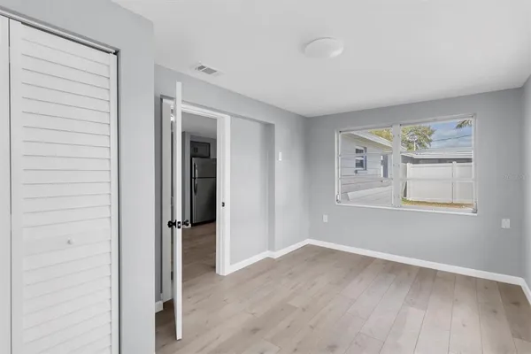 a view of livingroom with hardwood floor and hallway