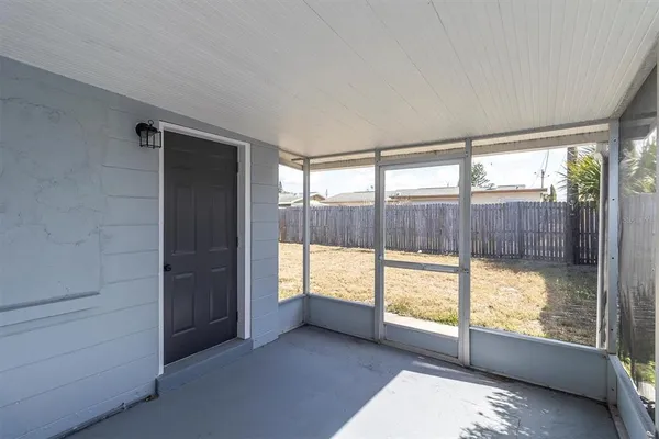 a view of a room with large windows