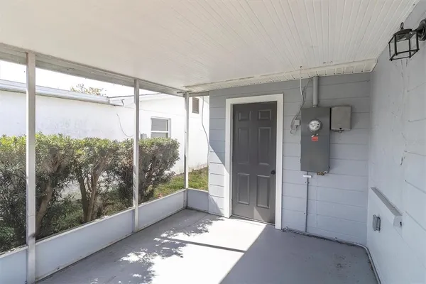 a spacious bathroom with a glass shower door and a window