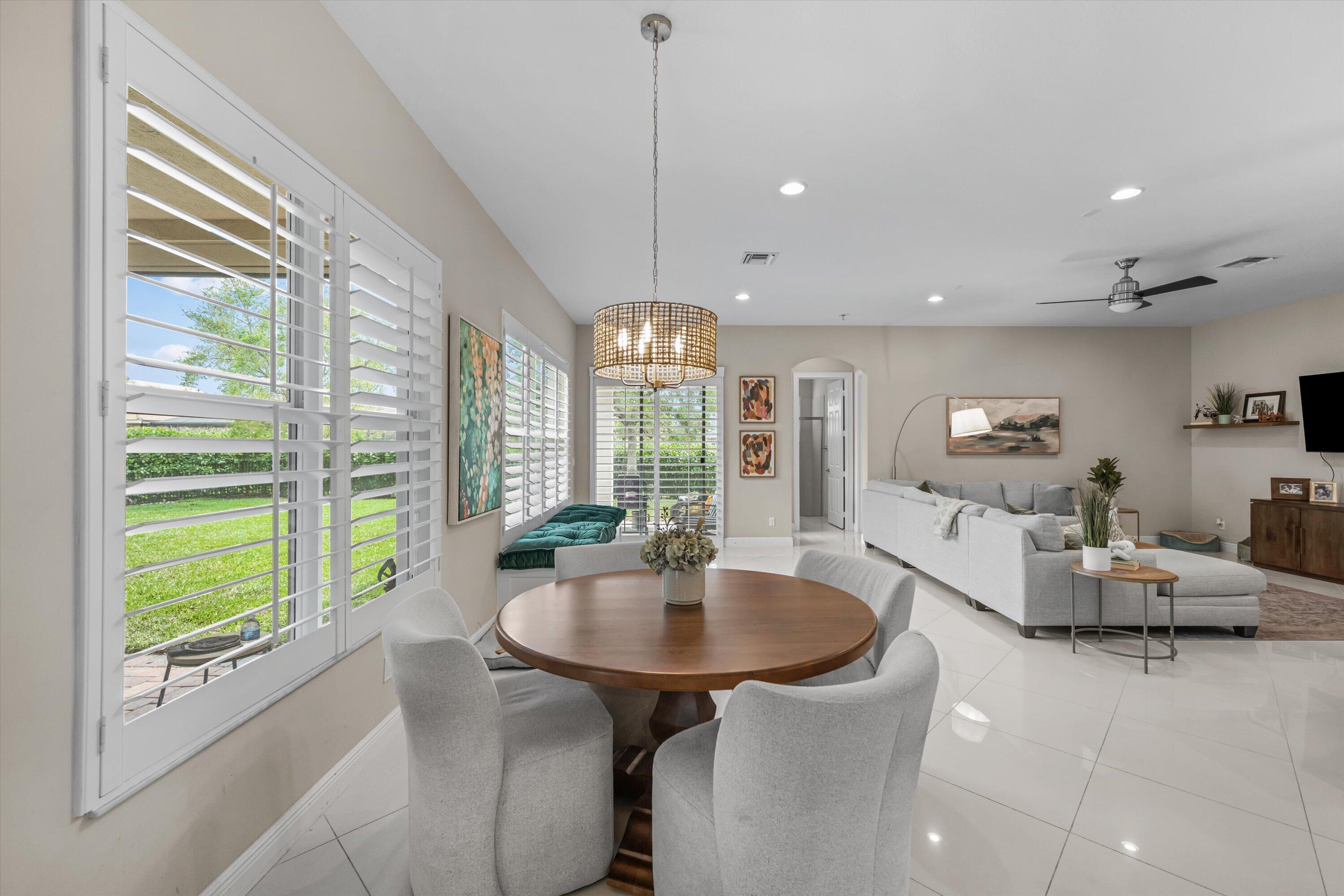 108 Casa Circle Jupiter, FL 33458 - Photo 9 of 53 a living room with furniture and a table
