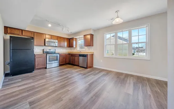 a view of kitchen with wooden floor