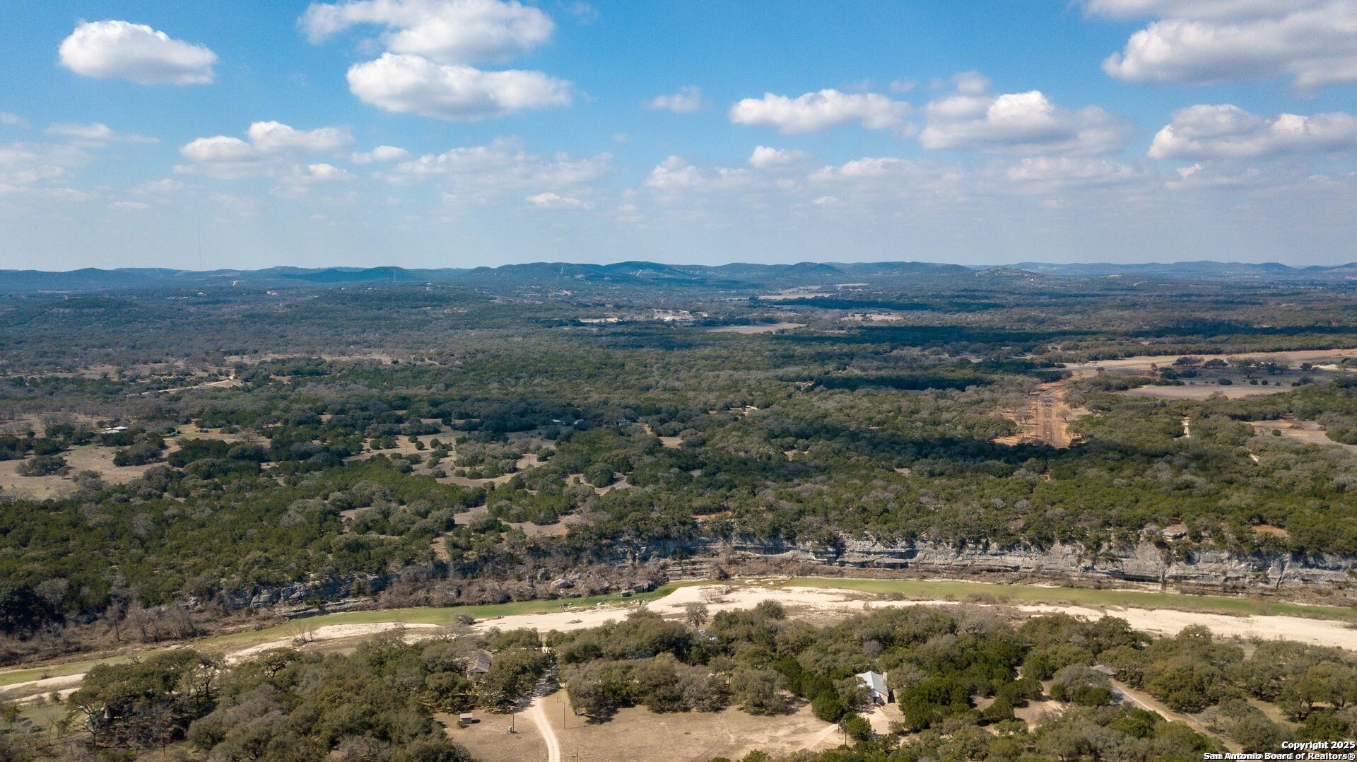 1246 Clearwater Canyon Road Bandera, TX 78003 - Photo 20 of 27 a view of a lake with a mountain
