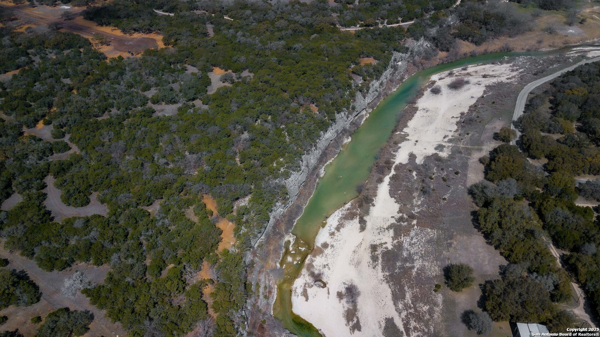 1246 Clearwater Canyon Road Bandera, TX 78003 - Photo 23 of 27 a view of a house with a yard