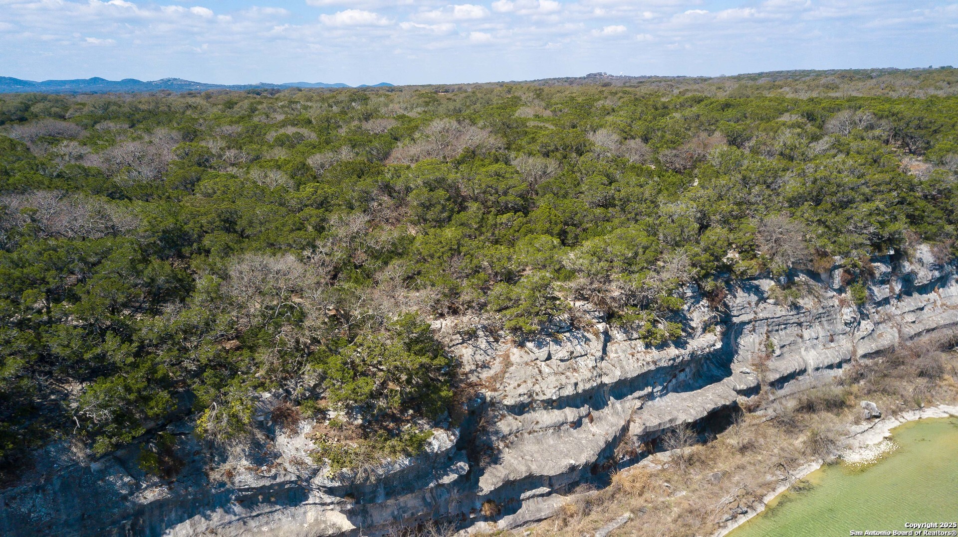 1246 Clearwater Canyon Road Bandera, TX 78003 - Photo 8 of 27 a view of a city with lush green forest