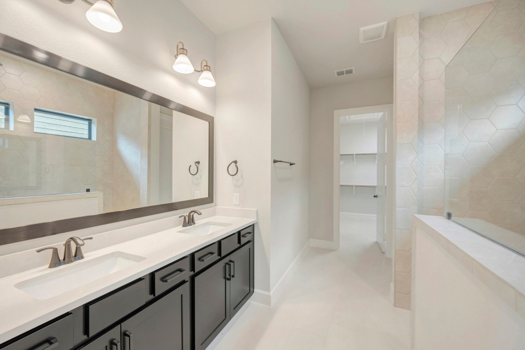 2722 Cottage Place Rosharon, TX 77583 - Photo 39 of 50 a bathroom with a double vanity sink a mirror and a shower