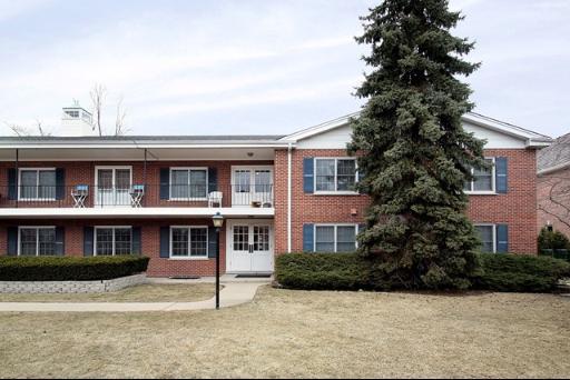 a front view of residential houses with yard