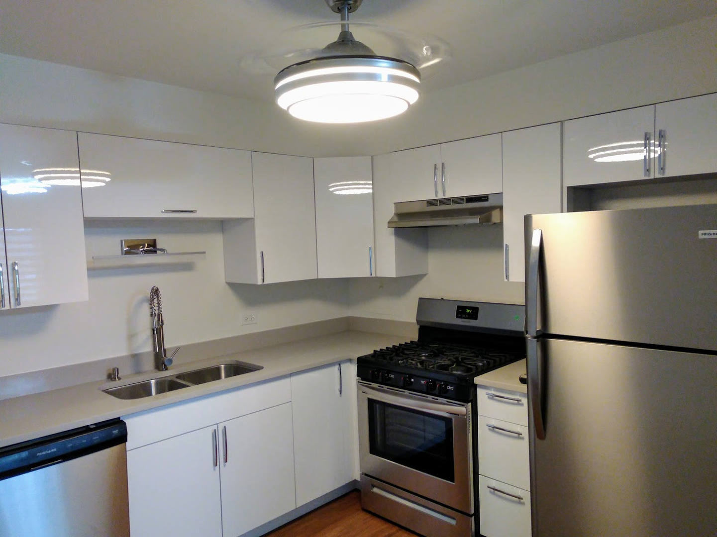 2822 Dundee Road, Unit 13B Northbrook, IL 60062 - Photo 3 of 10 a kitchen with stainless steel appliances granite countertop a sink stove and refrigerator