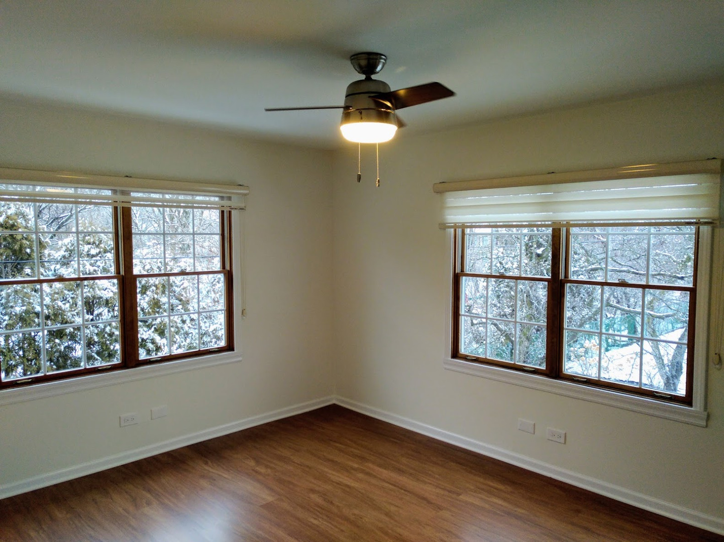 2822 Dundee Road, Unit 13B Northbrook, IL 60062 - Photo 5 of 10 a view of an empty room with wooden floor and a window