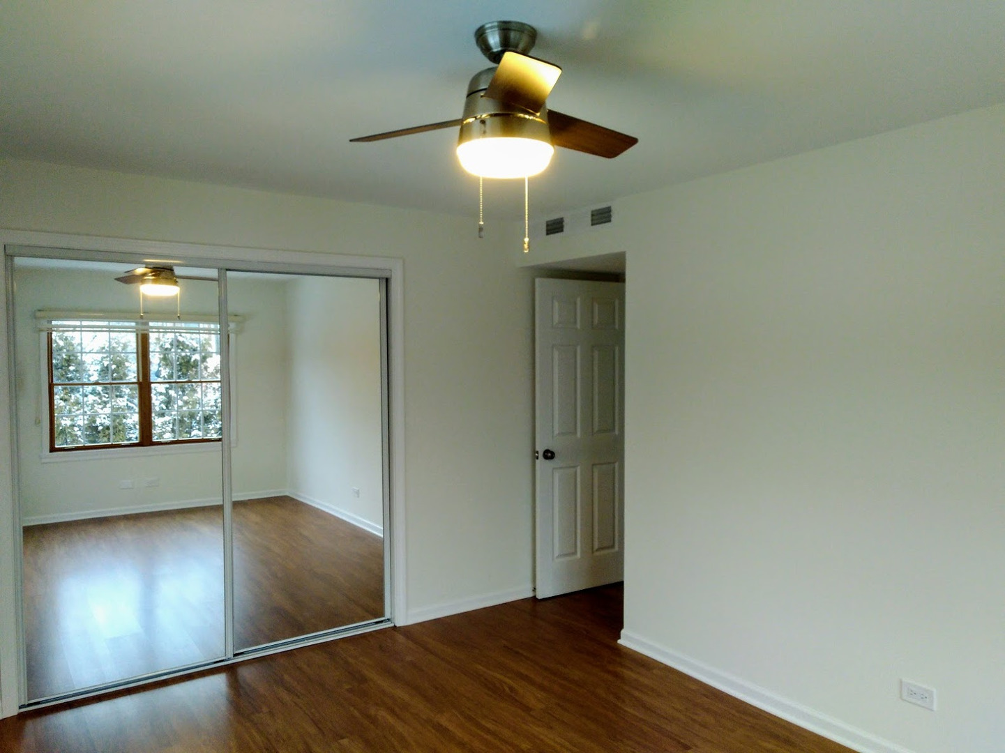 2822 Dundee Road, Unit 13B Northbrook, IL 60062 - Photo 6 of 10 wooden floor in an empty room with a window