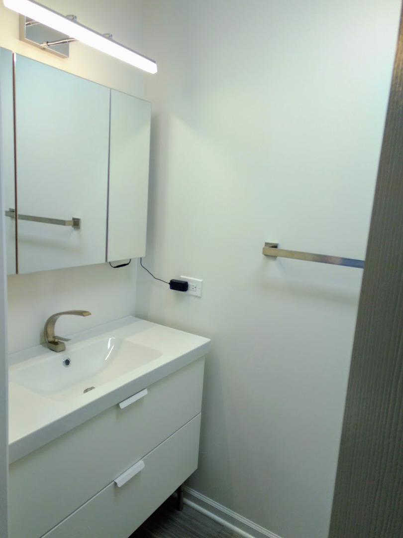 2822 Dundee Road, Unit 13B Northbrook, IL 60062 - Photo 10 of 10 a bathroom with a sink and a mirror