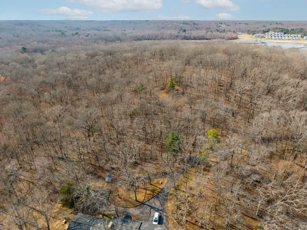a aerial view of a house with a yard