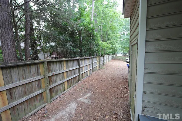 a backyard of a house with lots of green space