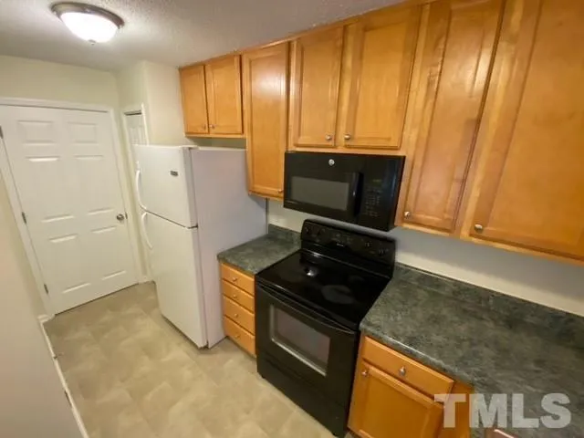 a refrigerator freezer sitting inside of a kitchen