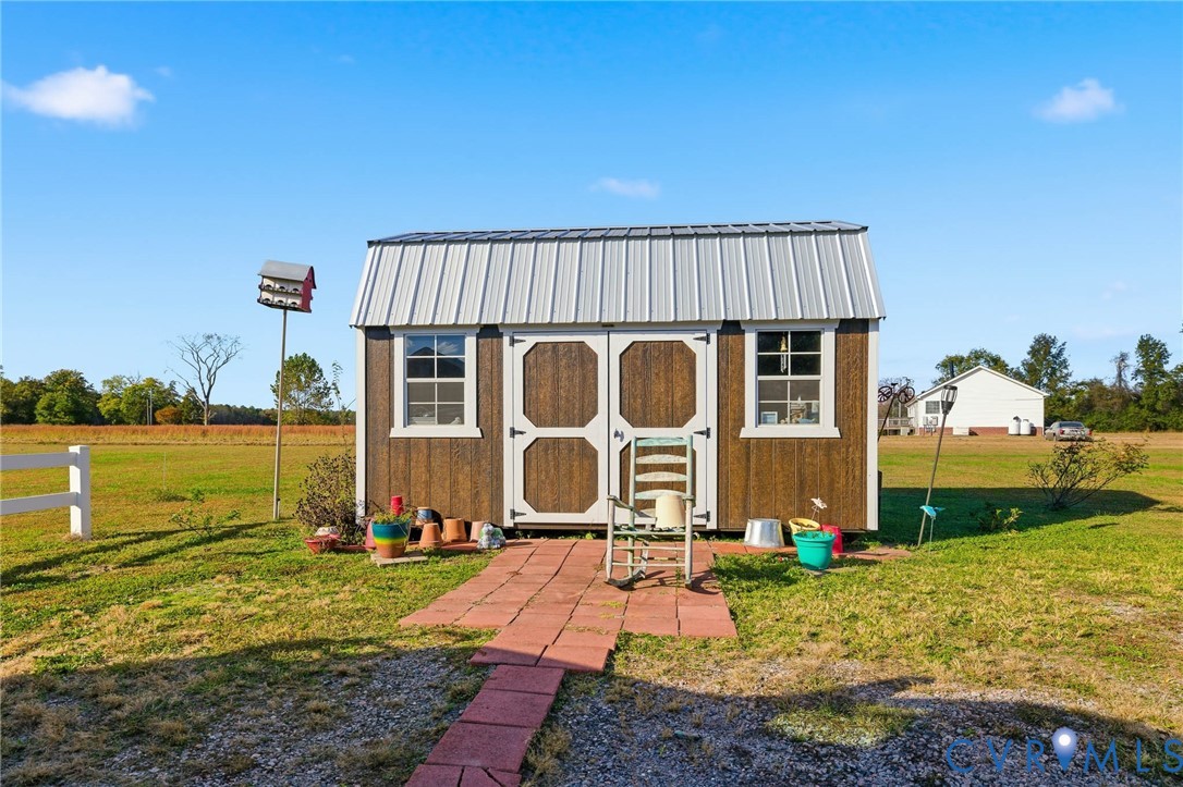 15900 Nobles Road Disputanta, VA 23842 - Photo 25 of 36 View of shed - (she/He) Floored and ready for tho