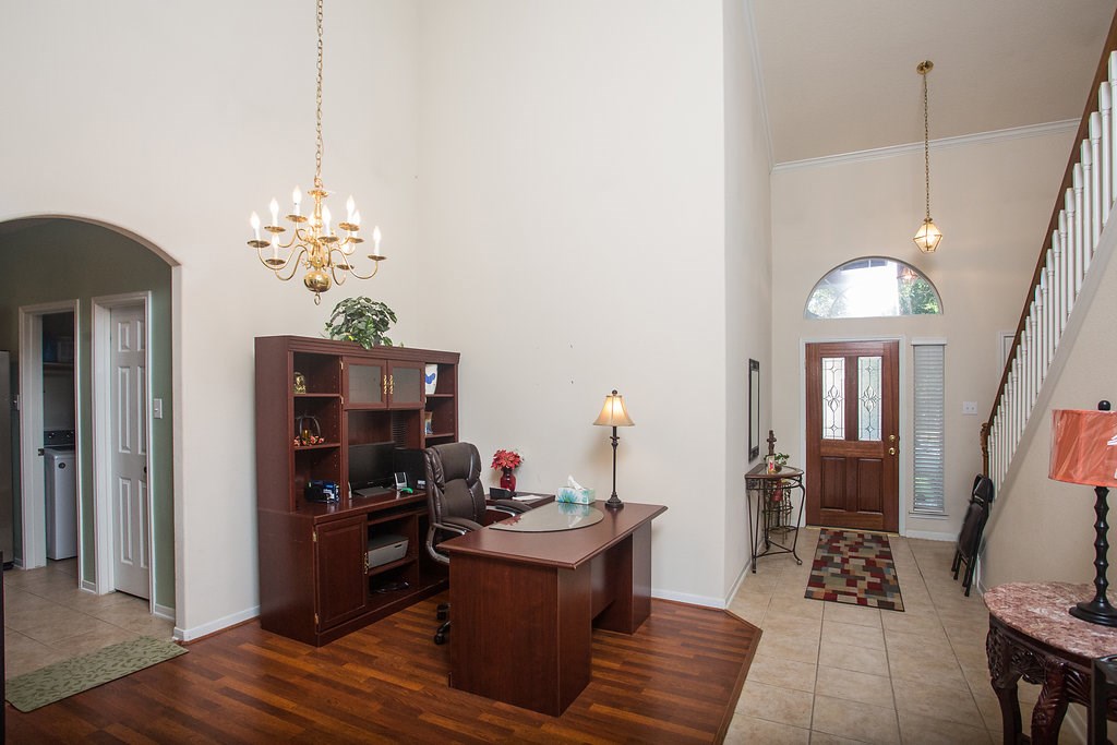 2930 Westerfield Lane Houston, TX 77084 - Photo 4 of 22 View of the entry and formal dining area. Notice the beautiful tile and wood laminate flooring.