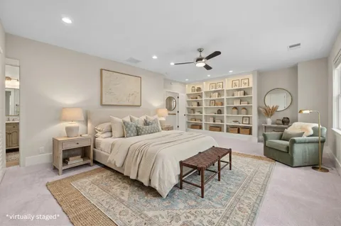 a spacious bedroom with a large bed and a window