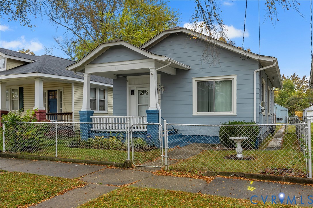 3208 Decatur Street Richmond, VA 23224 - Photo 2 of 12 View of front facade with a gate, a porch, and a f