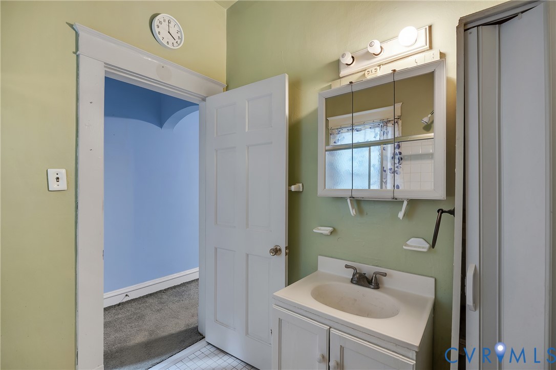 3208 Decatur Street Richmond, VA 23224 - Photo 5 of 12 Bathroom featuring vanity, light colored carpet, a