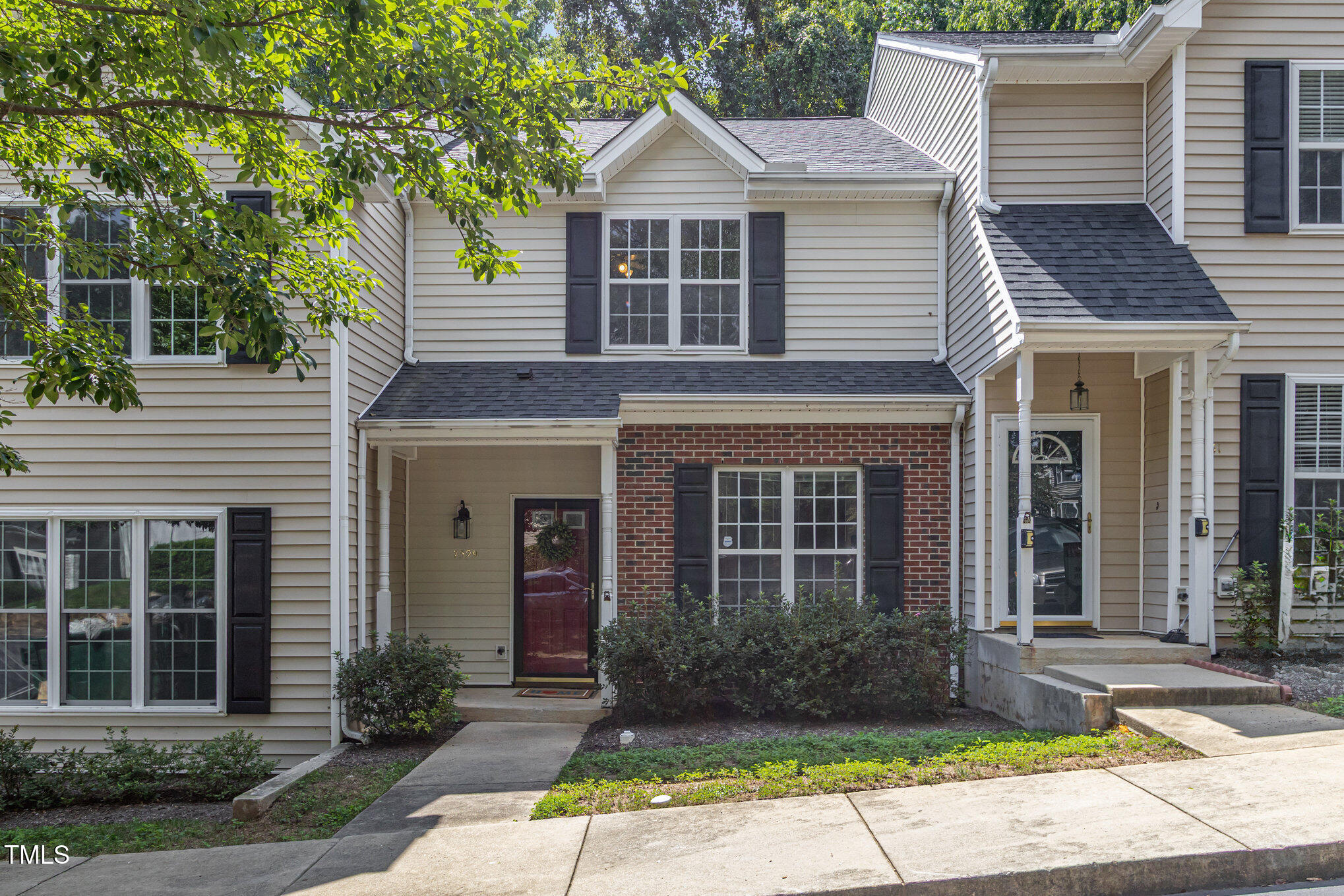 7329 Bonnie Ridge Court Raleigh, NC 27615 - Photo 1 of 17 a front view of a house with garden