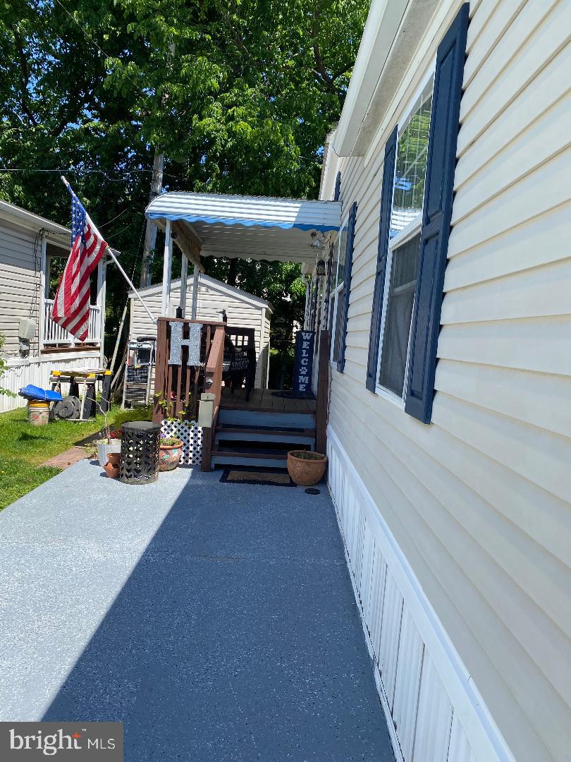14 Thomas Lane Sparrows Point, MD 21219 - Photo 6 of 26 a view of entryway with a small yard