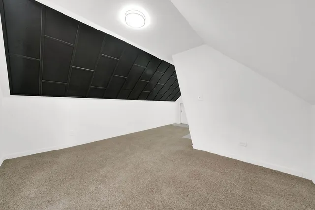 a white toilet sitting next to a white sink