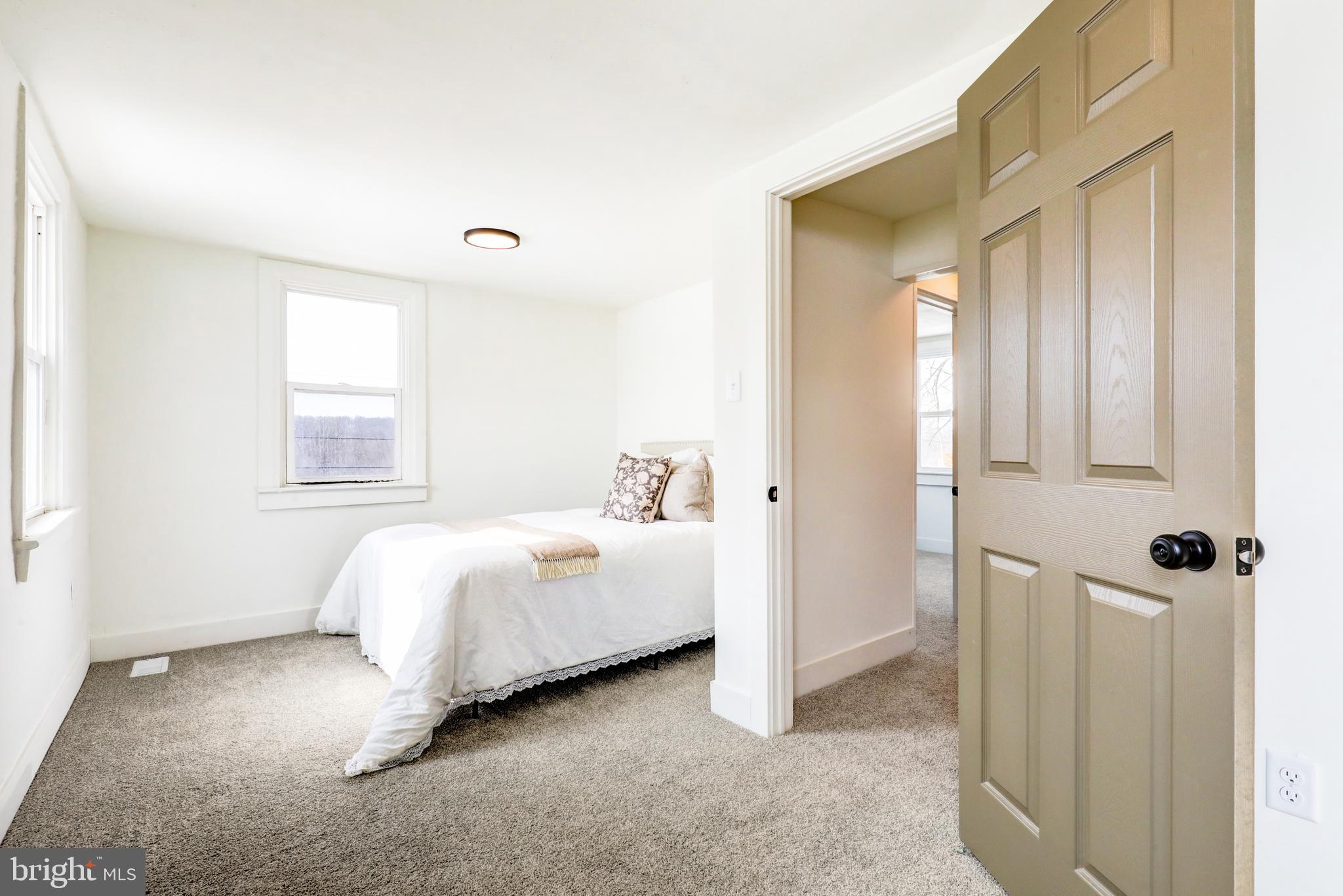 1419 Snyder Corner Road Red Lion, PA 17356 - Photo 20 of 30 a bed room with a bed and a window