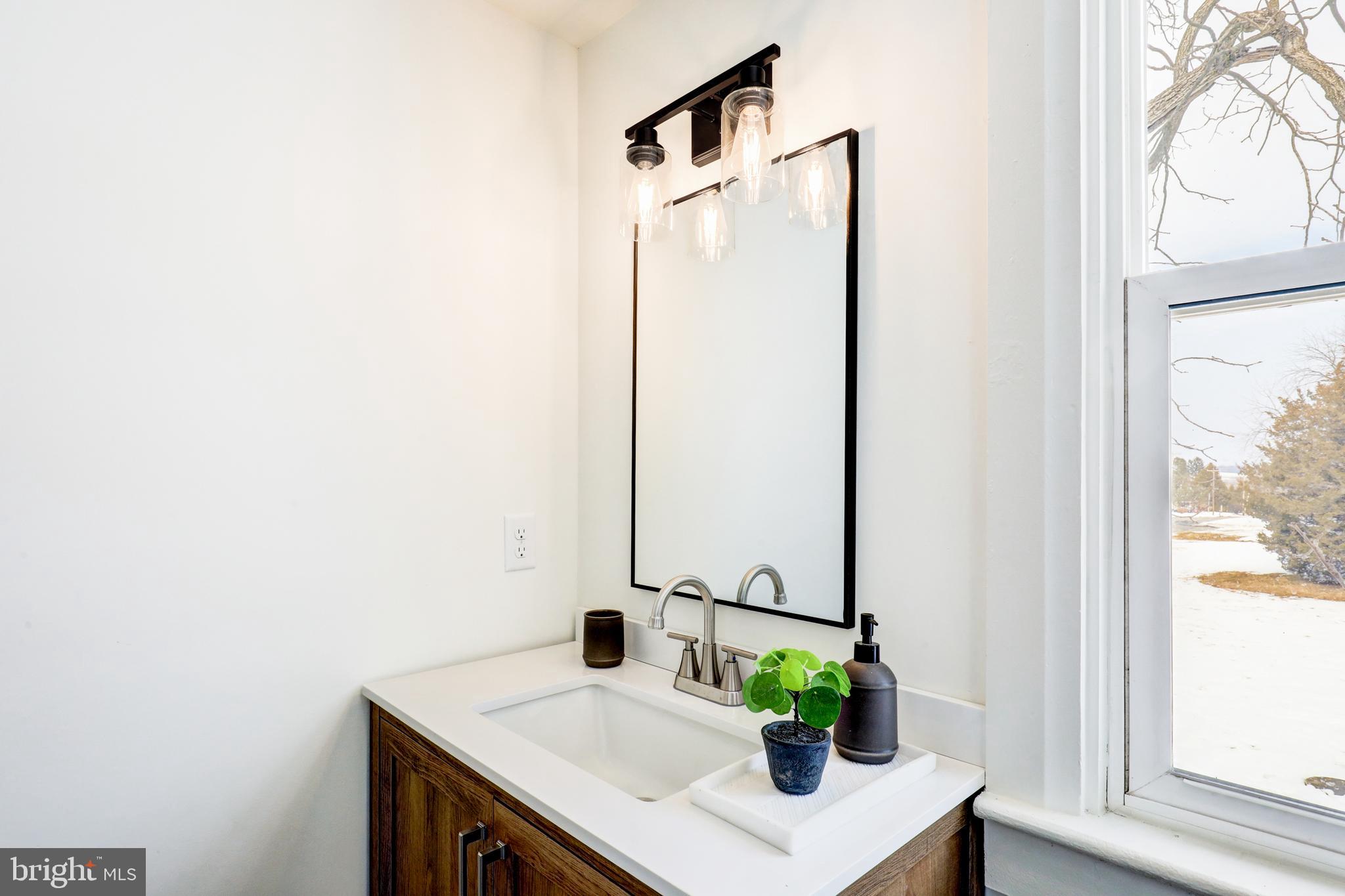 1419 Snyder Corner Road Red Lion, PA 17356 - Photo 25 of 30 a view of bathroom with a sink and mirror