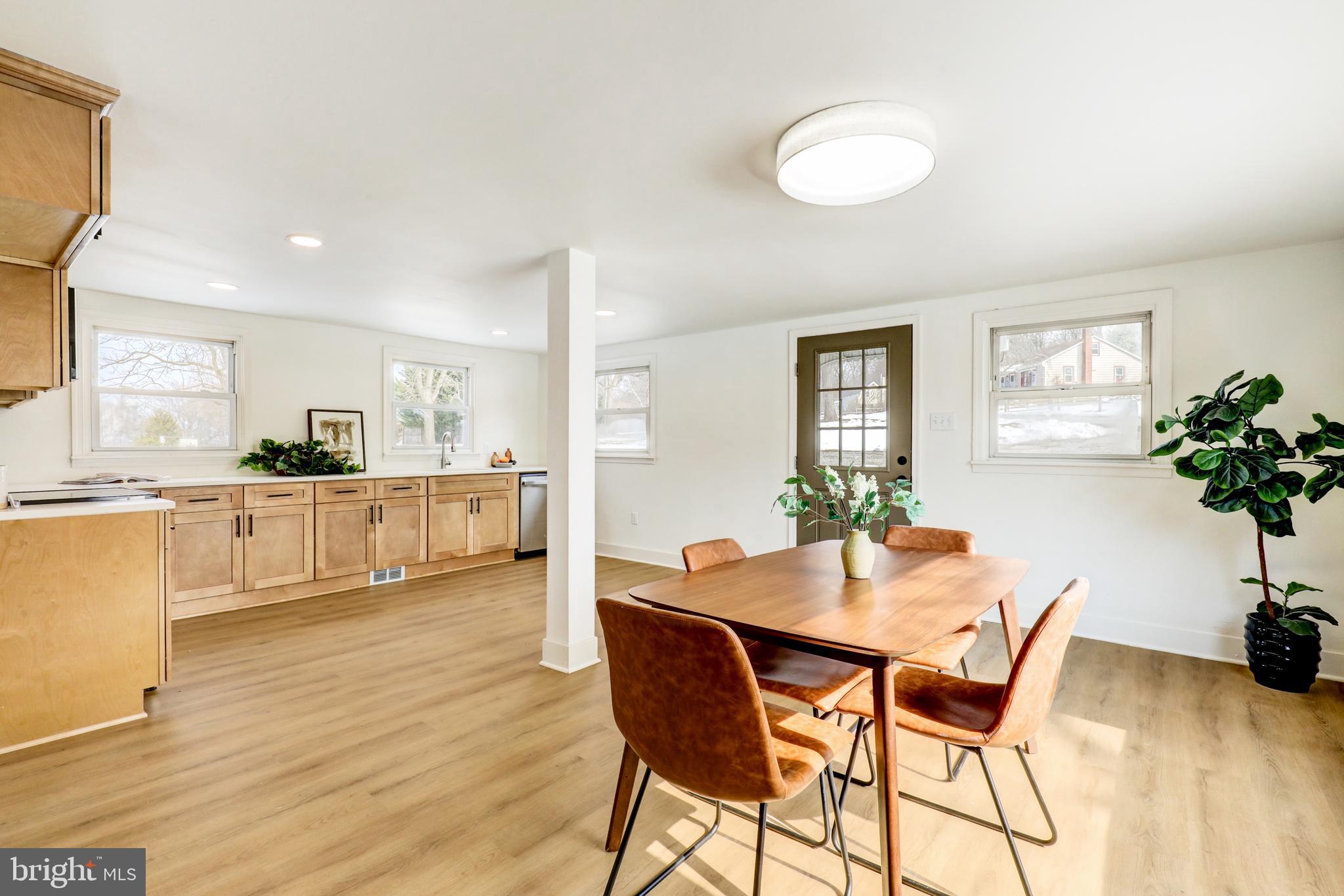 1419 Snyder Corner Road Red Lion, PA 17356 - Photo 7 of 30 a view of a dining room with furniture and wooden floor