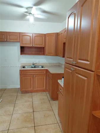 a kitchen with a cabinets and stainless steel appliances