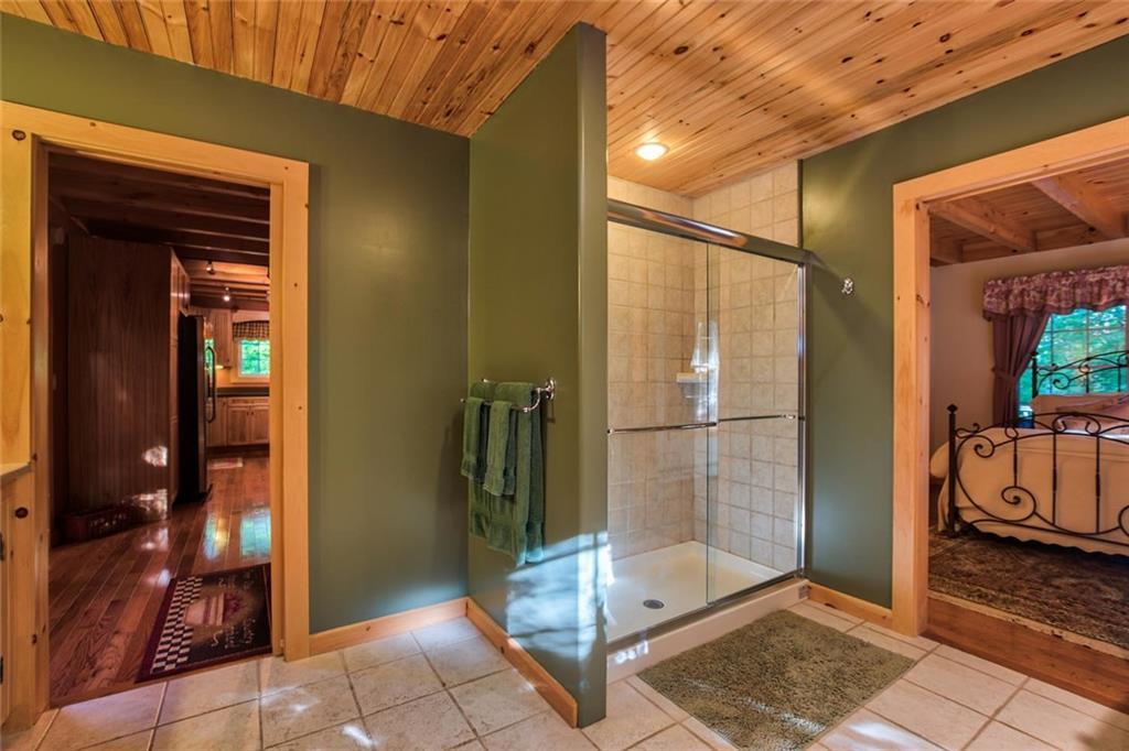 45 Lambs Mill Road Naples, ME 04055 - Photo 22 of 35 First floor bathroom with tiled and...