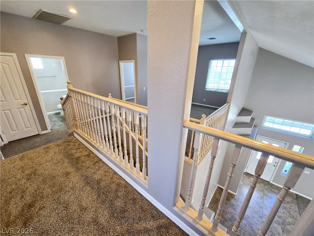 3759 Funston Way Las Vegas, NV 89129 - Photo 11 of 31 A split-level landing area with varied flooring seamlessly connects interior spaces.