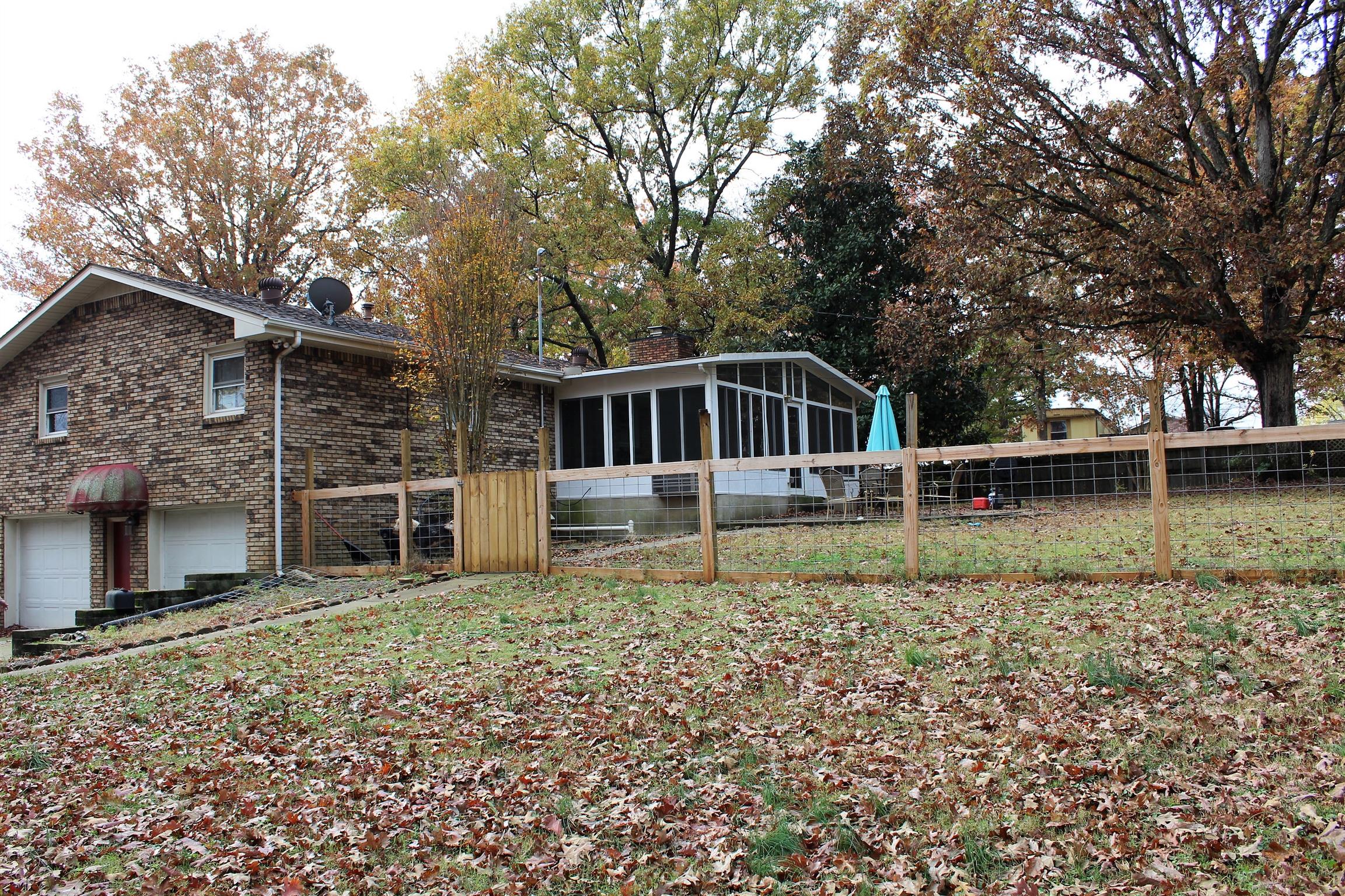 462 Furnace Hollow Road Dickson, TN 37055 - Photo 4 of 24 Back yard fenced for the animals, sunroom with hot tub