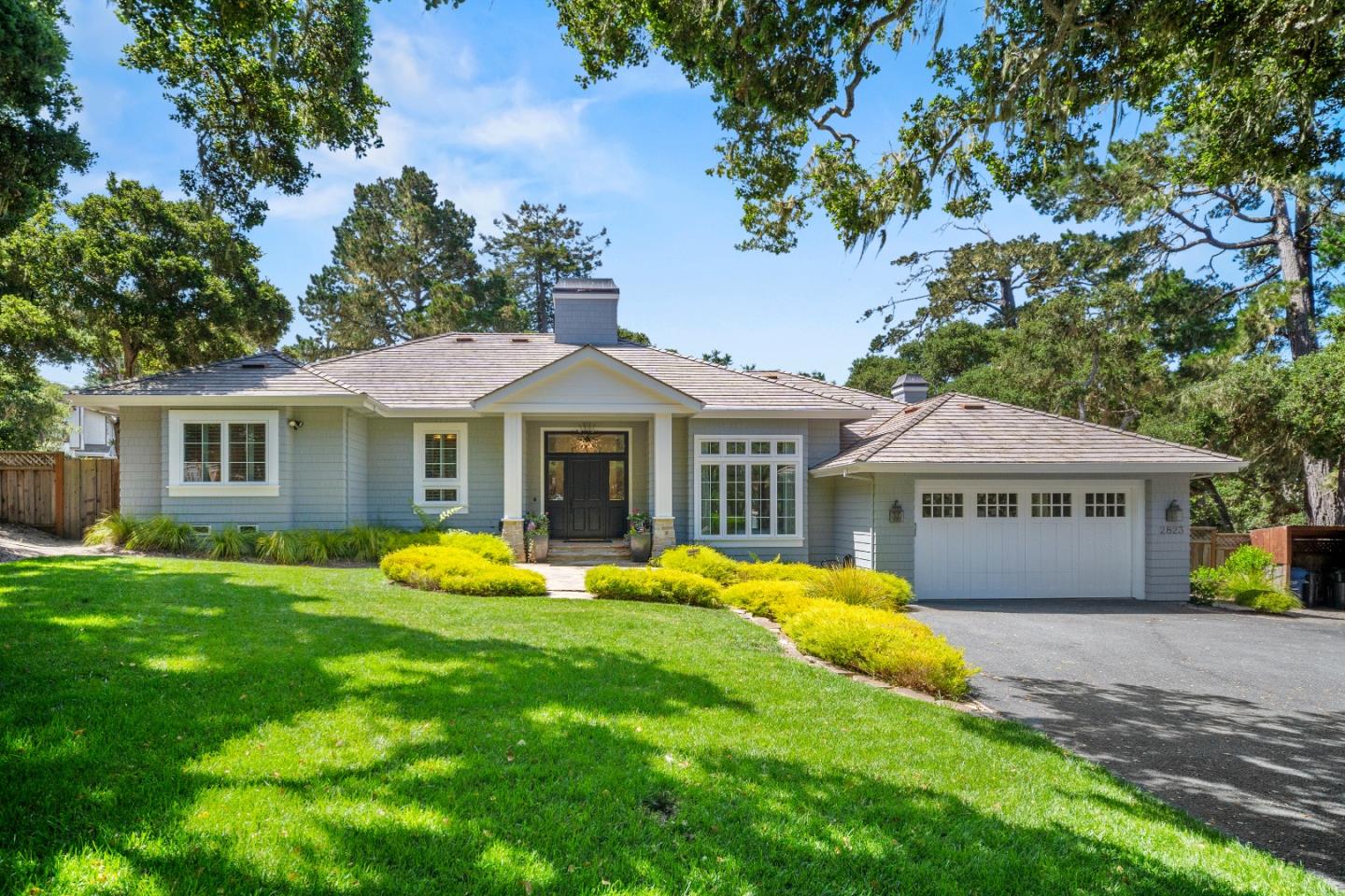 a front view of a house with a yard