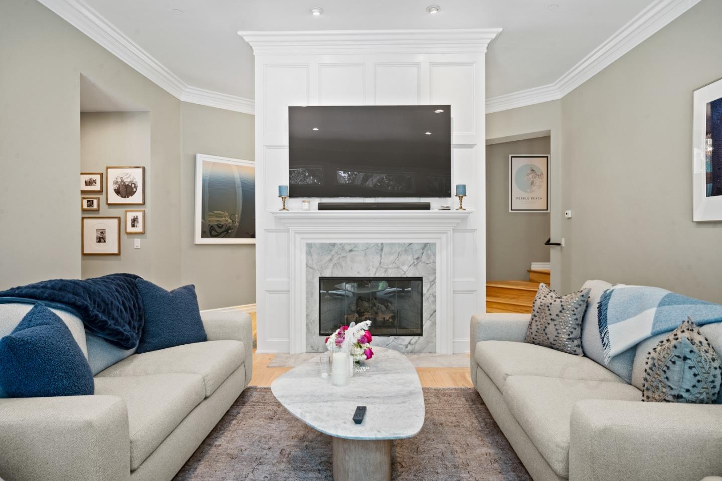 2823 Congress Road Pebble Beach, CA 93953 - Photo 18 of 49 a living room with furniture a flat screen tv and a fireplace