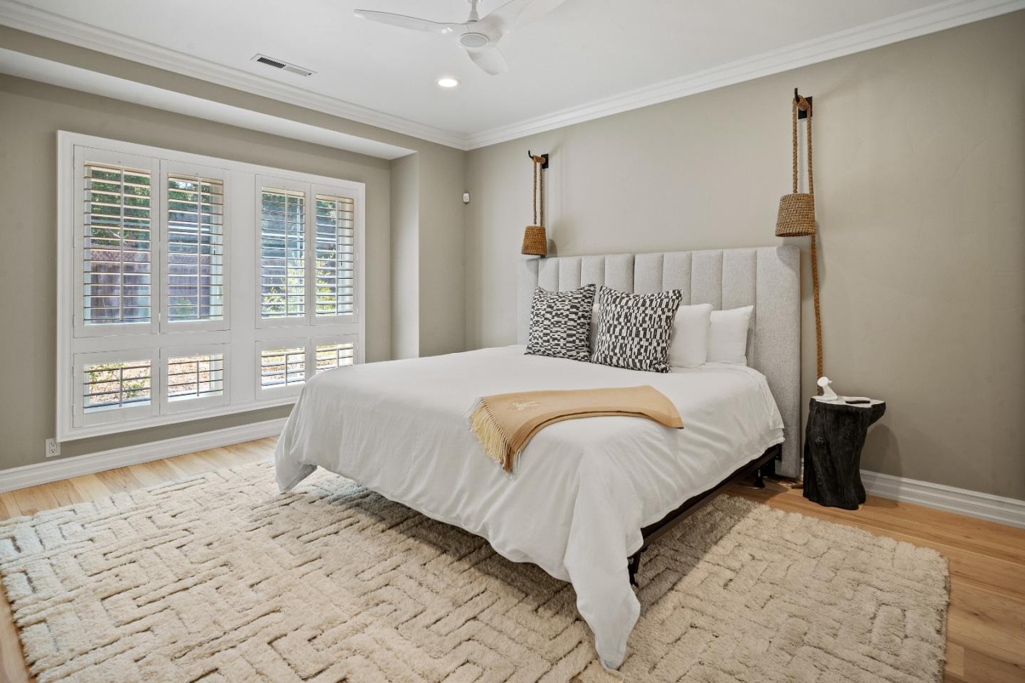 2823 Congress Road Pebble Beach, CA 93953 - Photo 26 of 49 a bedroom with a large bed and a window