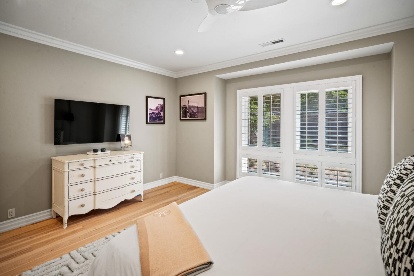 2823 Congress Road Pebble Beach, CA 93953 - Photo 28 of 49 a bedroom with furniture window and flat screen tv