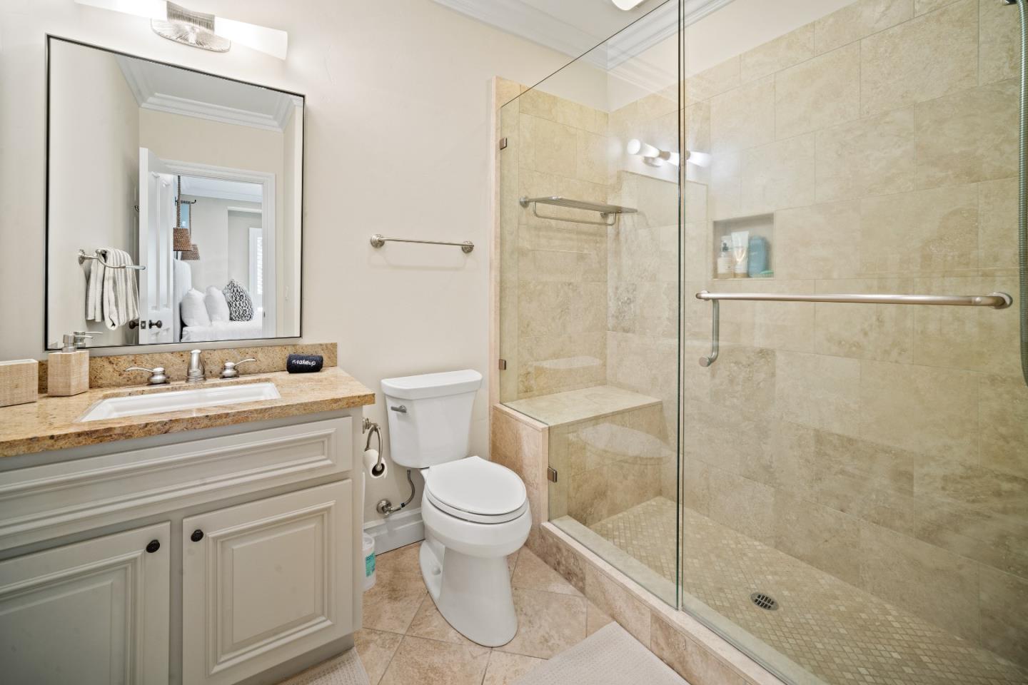 2823 Congress Road Pebble Beach, CA 93953 - Photo 29 of 49 a bathroom with a shower a sink a toilet and a mirror