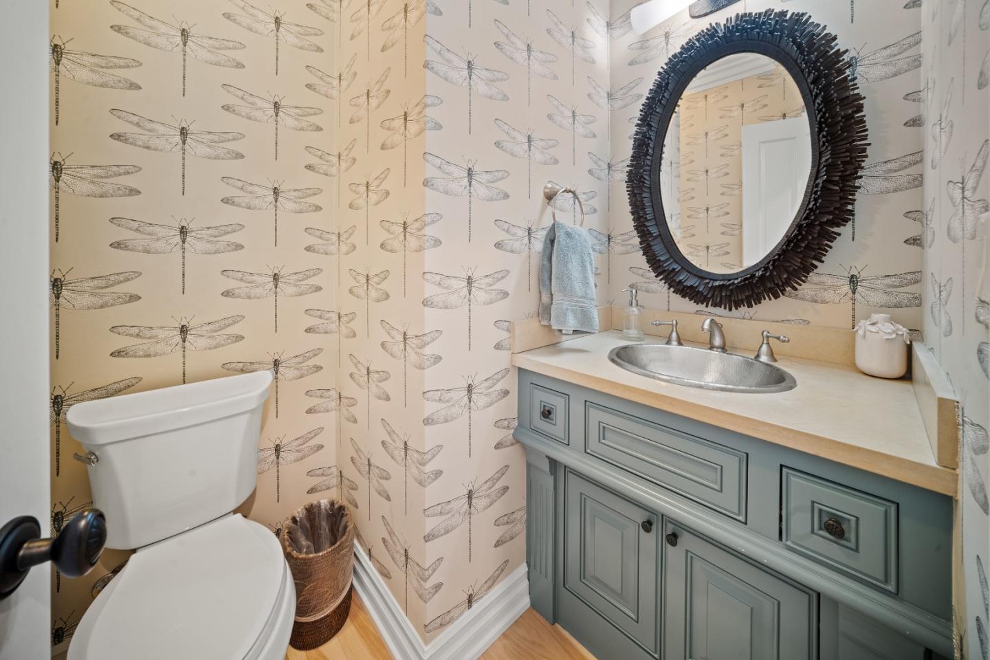 2823 Congress Road Pebble Beach, CA 93953 - Photo 32 of 49 a bathroom with a toilet sink vanity and mirror
