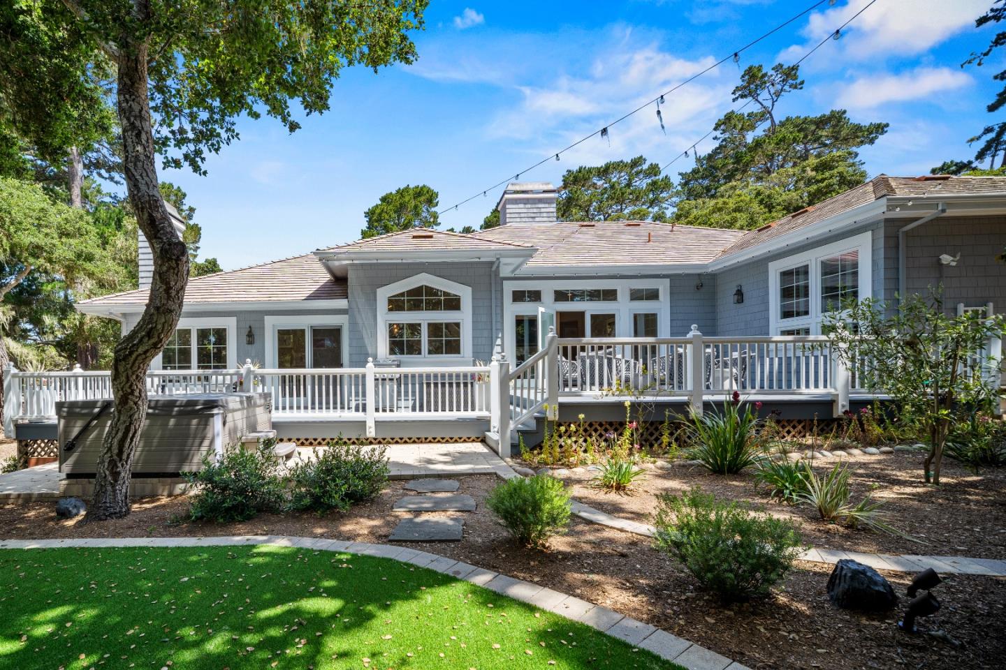 2823 Congress Road Pebble Beach, CA 93953 - Photo 35 of 49 a front view of a house with a yard table and chairs