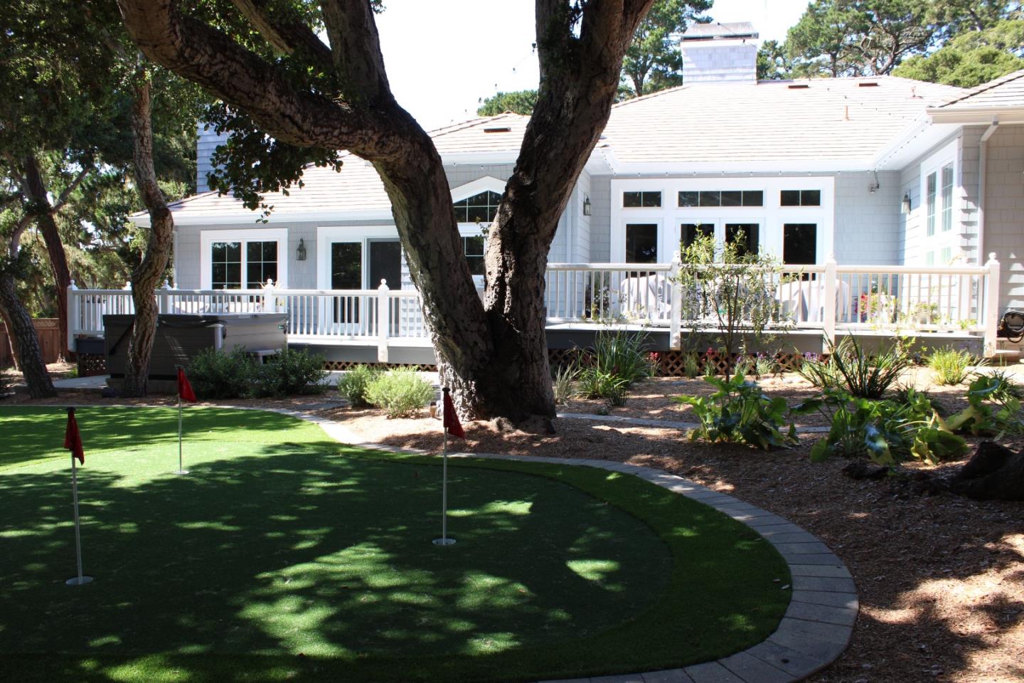 2823 Congress Road Pebble Beach, CA 93953 - Photo 36 of 49 a front view of a house with a yard